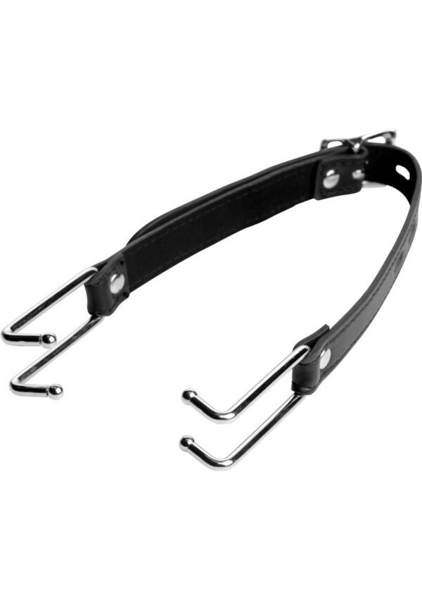 Pry that slutty mouth open with this intimidating spreader! Place the rounded tips in either side of their mouth and then adjust the strap until their lips are pulled taut. Their unique vulnerability and humiliation will fuel your arousal. A locking buckle allows you to trap them in the vice