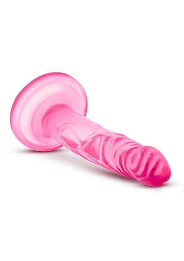 flat surface and is harness compatible. The Naturally Yours Mini Cock is designed for solo play