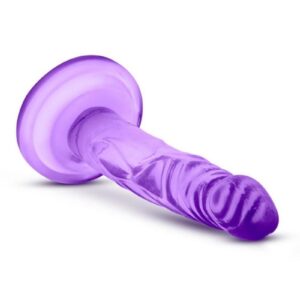 flat surface and is harness compatible. The Naturally Yours Mini Cock is designed for solo play