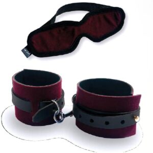 A burgundy blindfold with a full coverage shape and velvet feel