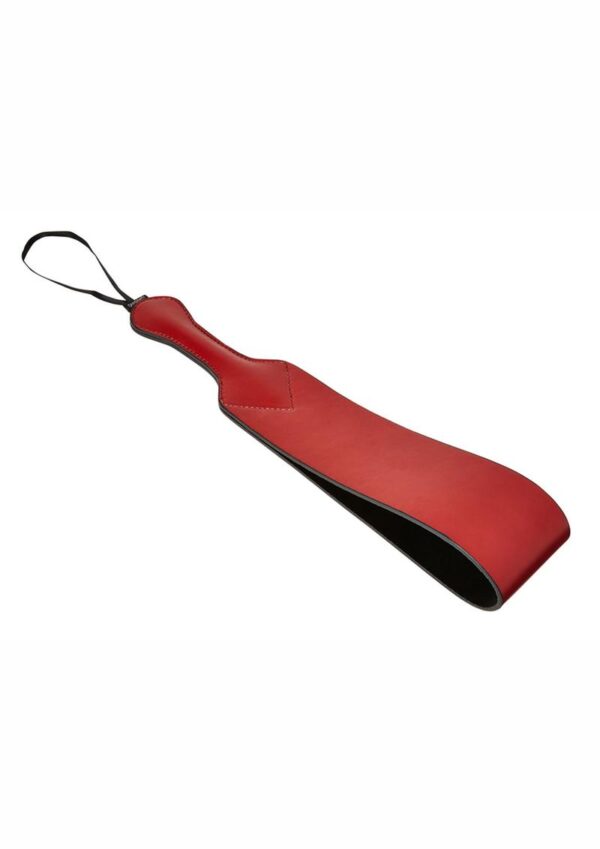 This unique paddle leaves a striking impression...    Your masochist may end up being naughty on purpose to feel the wrath and rapture of this instrument. Somewhere between the tip of a crop and a folded over belt lays this wicked Loop Paddle. Make them wince in anticipation as you send a satisfying smack through the air to warn them of the painful pleasure that awaits. The crimson loop gives you creative leeway to taunt