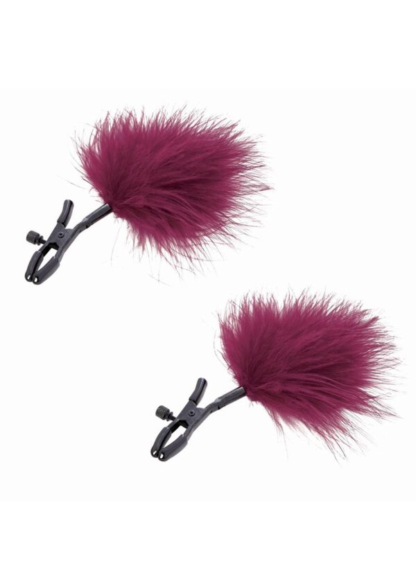 Be brought to the next level of ecstasy with the adjustable Enchanted Feather Nipple Clamps making it easy for varying levels of pressure play. Allow your partner to test your boundaries by compressing or releasing pressure. Removable plastic tips let you determine the level of extreme you`ll reach. Soft and alluring these feathers increase sensation and can be used to tease your partners even when they aren`t being worn.