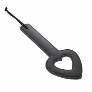 Heighten impact play and leave a mark of your heart with the Shadow Heart Paddle. You won`t have to worry about losing your grip with the sturdy handle and wrist strap making this paddle is easy to wear and ready to use when your partner needs to be dominated. Leave soft love swats all over your sub`s body