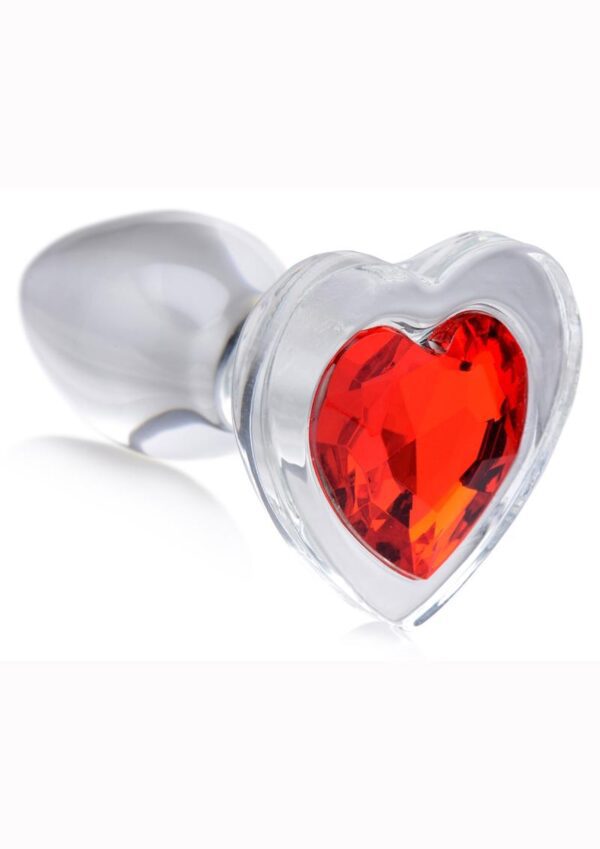 Decorate your derriere with a sparkling red heart! Display your love between your cheeks with these see-through glass butt plugs - the solid mass and smooth surface fills your backdoor with a satisfyingly hard sensation! Perfect for warming up or as a dedicated anal pleasure toy.Smooth and tapered for easy entry without discomfort and compatible with most lubricants so you can play your way. Heat or chill this heart shaped anal dream for an an extra layer of pleasure!This see through glass plug is naturally body safe and hypoallergenic for those with sensitive bodies. The smooth texture also makes these plugs easy to clean with warm water and mild soap - be sure to clean before and after use!Perfect for warming up your backdoor for rougher play or simply as a treat for the eyes for your partner while they enjoy the rest of your body! This medium sized plug is perfect for intermediate anal players or for beginners seeking to stretch their hole to the next level. Insert this heart shaped Booty Spark and make that booty sparkle!Measurements: Overall length 2.8 inches