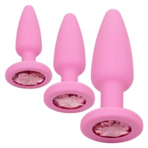 Give into your naughtiest fantasies and open yourself up to thrilling backdoor play with the First Timeandreg; Crystal Booty Kit. This glamorous kit includes a set of 3 graduated anal plugs with a gem base to let you safely and comfortably increase passionate anal stimulation. To enjoy everything the exhilarating world of anal play has to offer