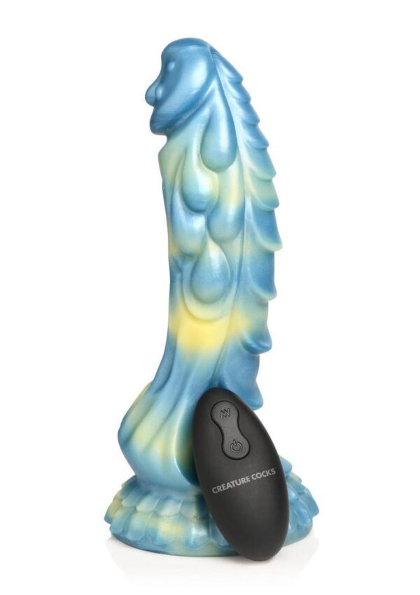 This gorgeous Sea Stallion dildo is blue and yellow with an iridescence that catches the light. The mushroom head has a delightful dripping bead of sea foam coming down from the head and paisley shaped designs along the shaft. On one side of the shaft are rows of ribbed scales. Enjoy hands-free rides when placing the strong