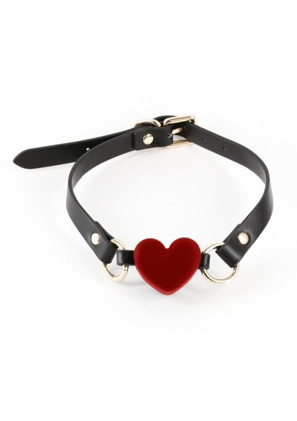 Tease and tantalize your submissive lover with Fetish and Fashion`s collection of seductive ball gags. Silicone mouthpiece. Strap is made from synthetic materials (PU) and nickel-free hardware and features an adjustable buckle closure. Fetish andamp; Fashion Ball Gags are available in a variety of shapes and sizes.  Katherine is a breathable ball gag - this product does not create a seal on the lips.  Air can pass through the V area on the heart.  Waterproof Rating - IPX8.