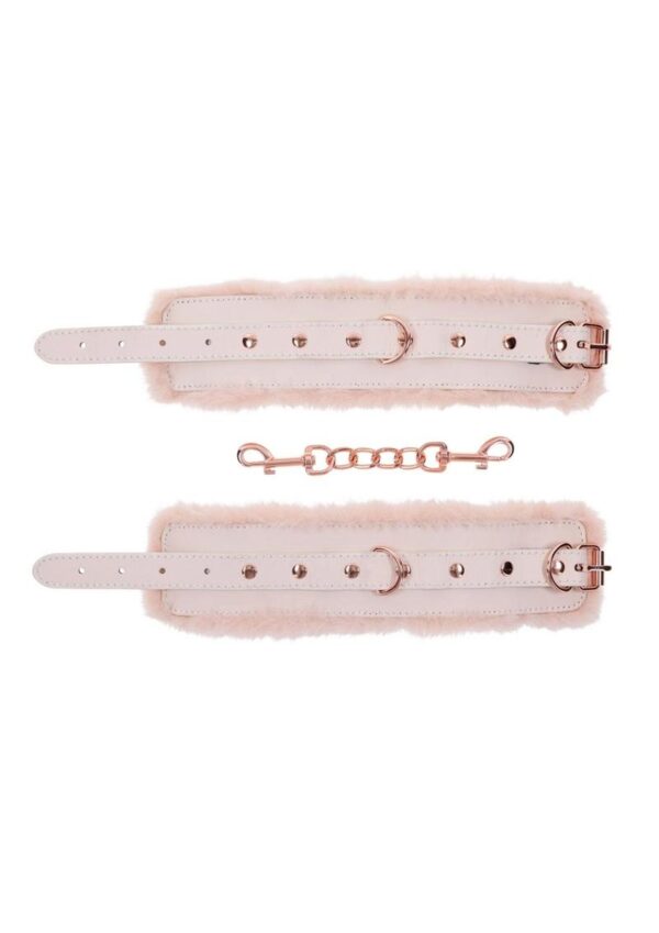 Indulge in a world of playful pleasure with our Peaches n CreaMe Faux Fur Cuffs! These handcuffs are not just an accessory; they`re a flirty invitation to elevate your intimate moments. Wrapped in the softest light peach-colored faux fur