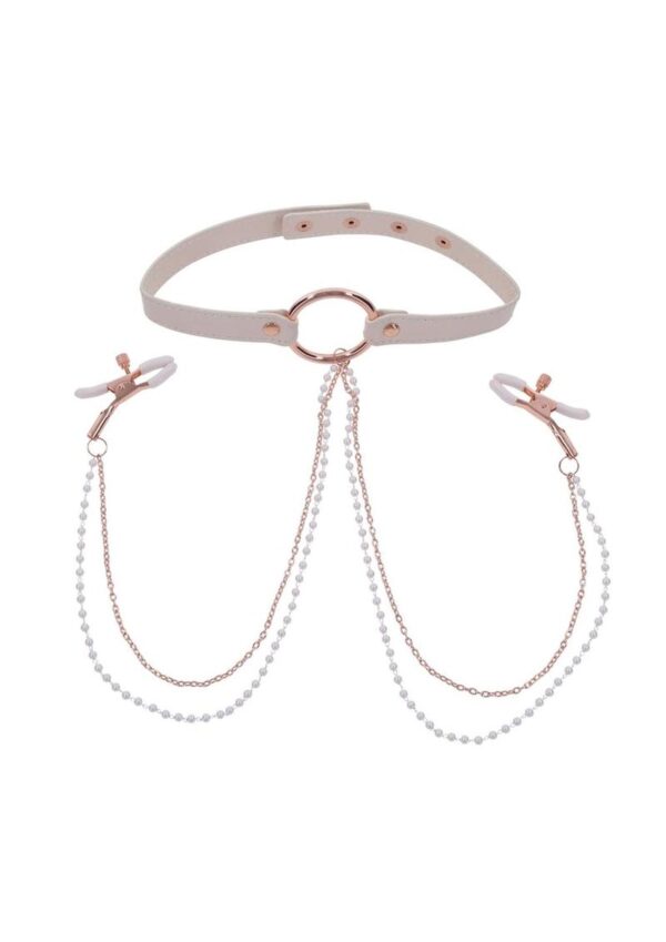Spice up your playtime with the Peaches n CreaMe Collar with Nipple Clamps and experience extraordinary pleasure! This playful accessory blends luxury with a touch of naughtiness