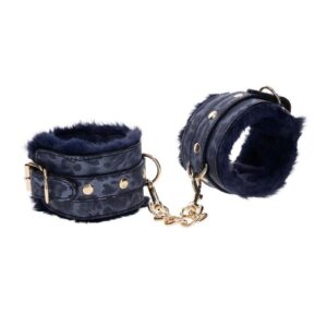 Embrace the allure of playful restraint with the Cougar Fur Handcuffs. Luxuriously lined with a rich blue faux fur and accented with gleaming gold hardware