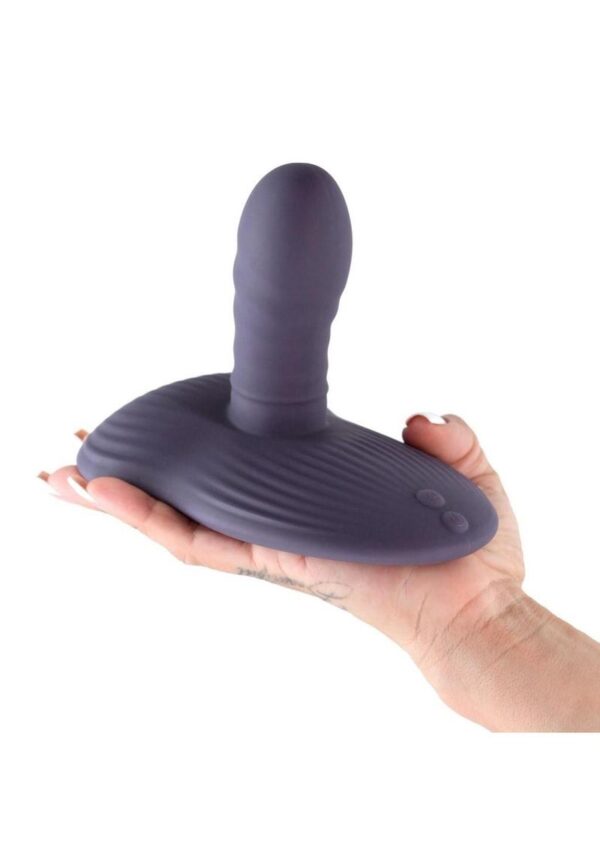 a vibrating pad and a suction feature to allow hands free use. Operable alone or via a downloadable APP and suitable for sitting or laying