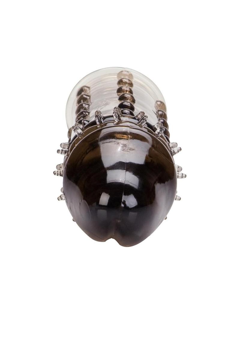 ribbed extension with an accentuated penis head. Comfortable and discreet. Unscented TPR. One size fits all trim to fit. 6.25x 1.5/ 16 cm x 4 cm.