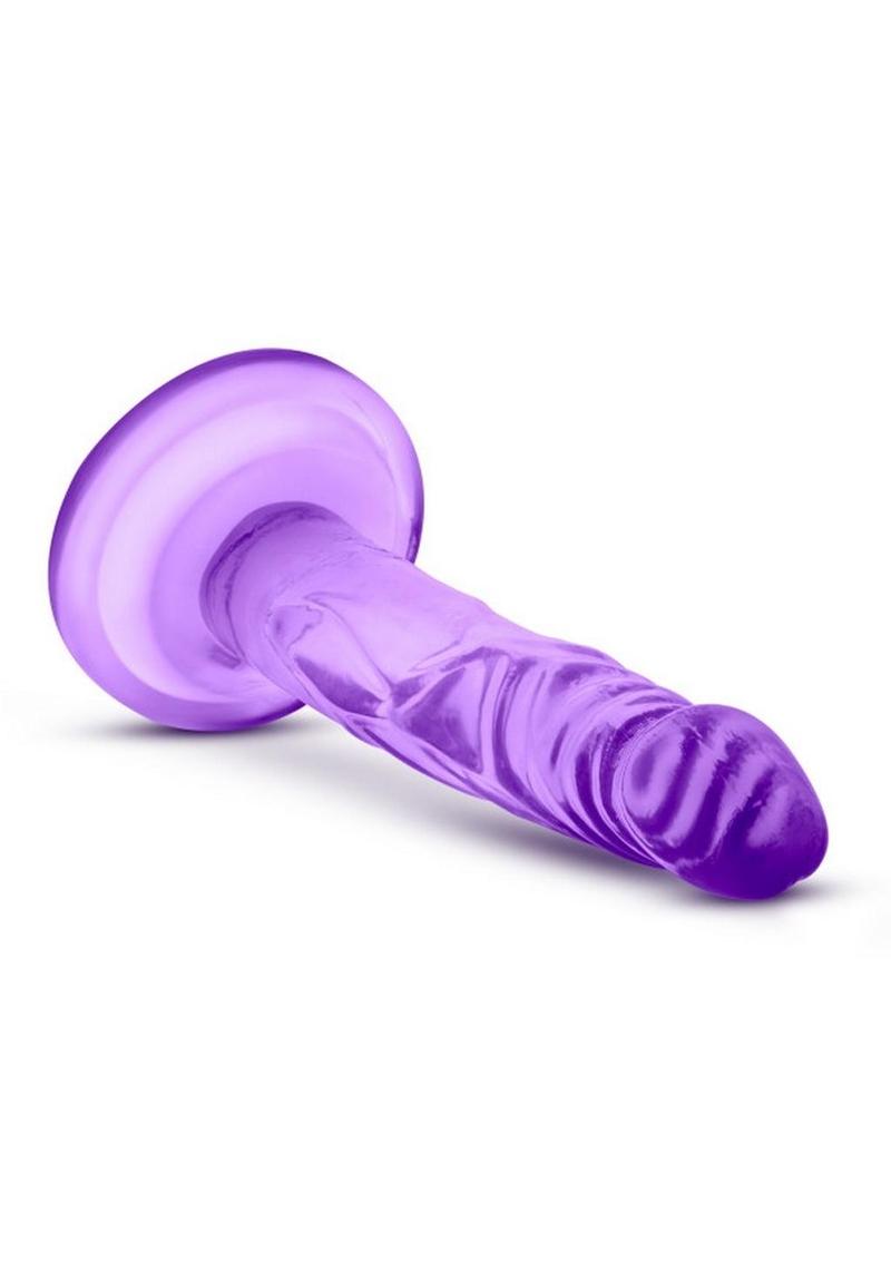 flat surface and is harness compatible. The Naturally Yours Mini Cock is designed for solo play