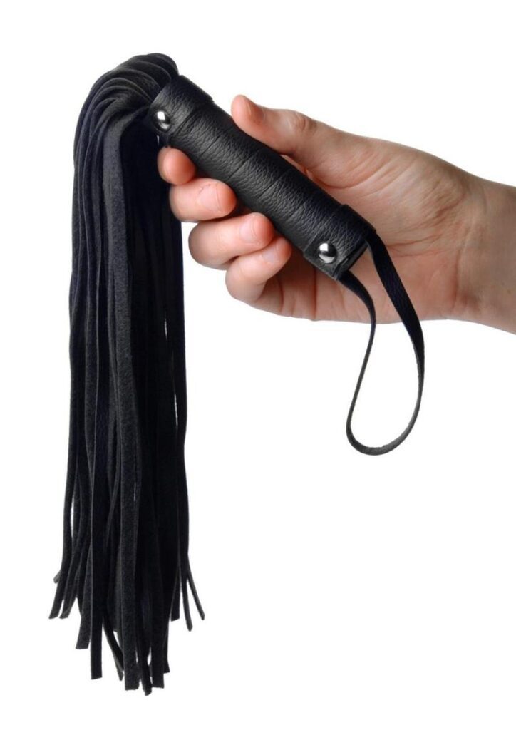 Get a handful of pleasure and pain with this pint sized hand flogger. The man made leather is soft and textured for realism. The spiral wrapped handle has two silver studs and is topped with a wrist loop
