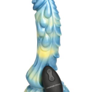 This gorgeous Sea Stallion dildo is blue and yellow with an iridescence that catches the light. The mushroom head has a delightful dripping bead of sea foam coming down from the head and paisley shaped designs along the shaft. On one side of the shaft are rows of ribbed scales. Enjoy hands-free rides when placing the strong