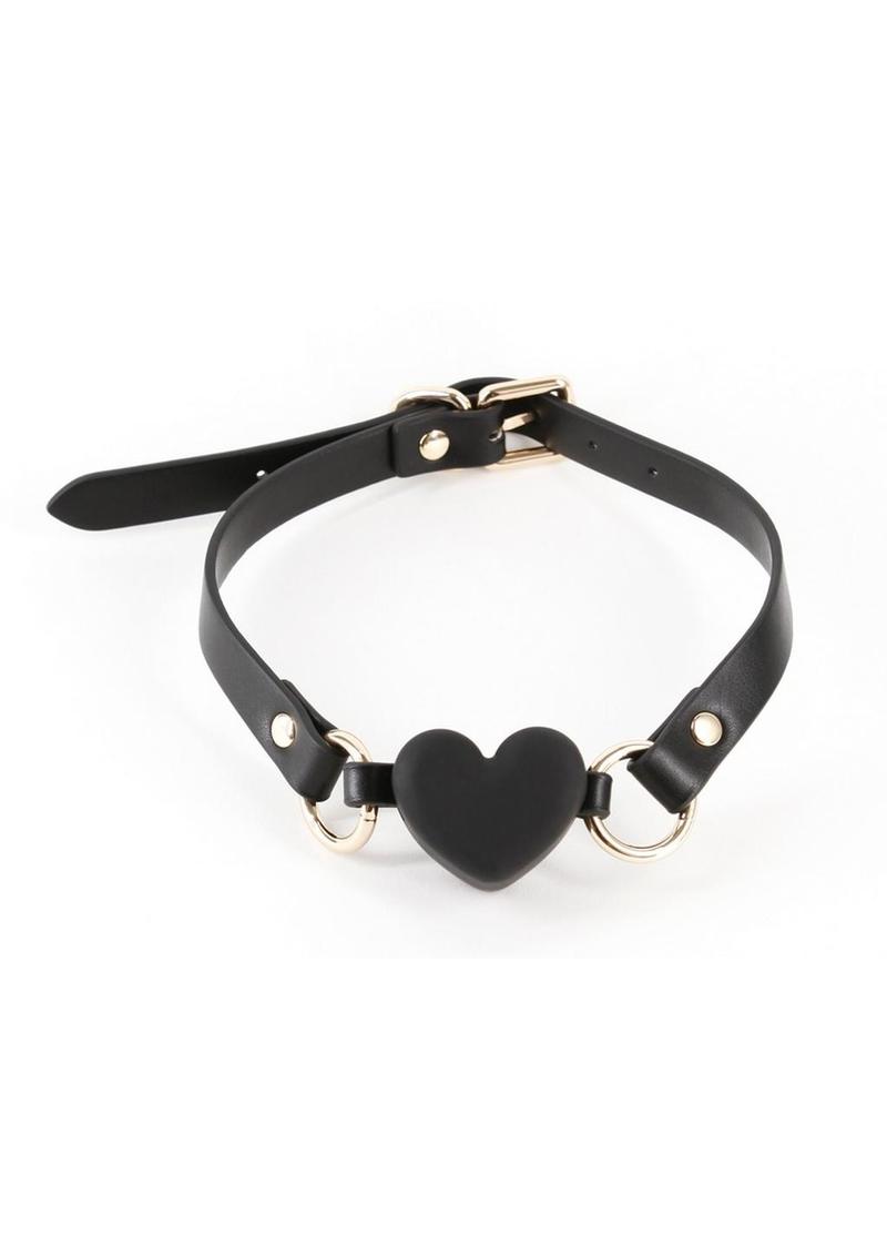 Tease and tantalize your submissive lover with Fetish and Fashion`s collection of seductive ball gags. Silicone mouthpiece. Strap is made from synthetic materials (PU) and nickel-free hardware and features an adjustable buckle closure. Fetish andamp; Fashion Ball Gags are available in a variety of shapes and sizes. Katherine is a breathable ball gag - this product does not create a seal on the lips. Air can pass through the V area on the heart. Waterproof Rating - IPX8.