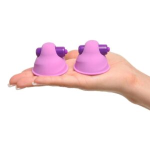 She cupped her breast and placed the Vibrating Nipple Suck-Her on her sensitive nipple. The dainty pleasure nubs tickled her sensitive skin as she gently pressed the soft